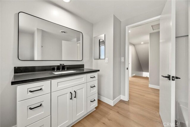 1141 N Palm St, La Habra, CA 90631 - bathroom with wood finished floors, vanity, and recessed lighting