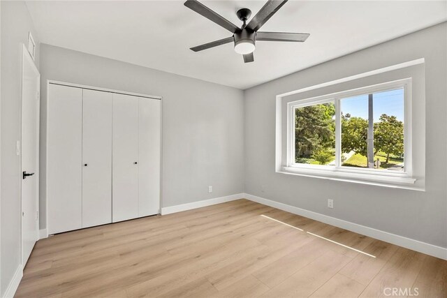 1141 N Palm St, La Habra, CA 90631 - unfurnished bedroom featuring light wood-type flooring, a closet, and a ceiling fan
