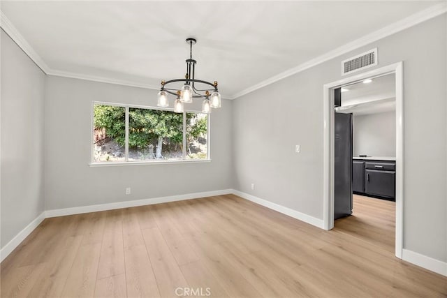 1141 N Palm St, La Habra, CA 90631 - unfurnished room with a chandelier, ornamental molding, and light wood-style floors