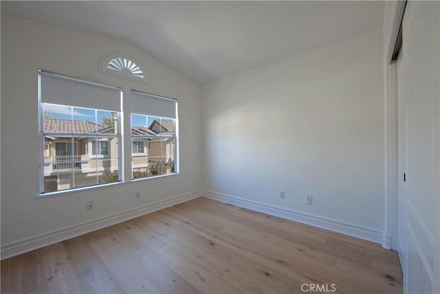 7 Luzern, Mission Viejo, CA 92692 - spare room featuring lofted ceiling, light wood finished floors, and plenty of natural light