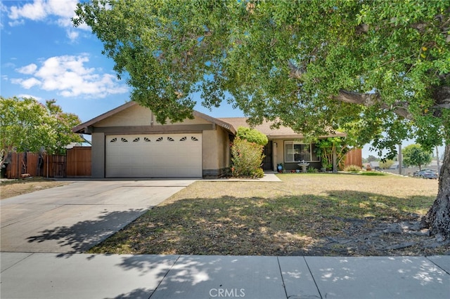 1926 E 7th St, Ontario, CA 91764 - view of front facade featuring a garage, concrete driveway, and stucco siding