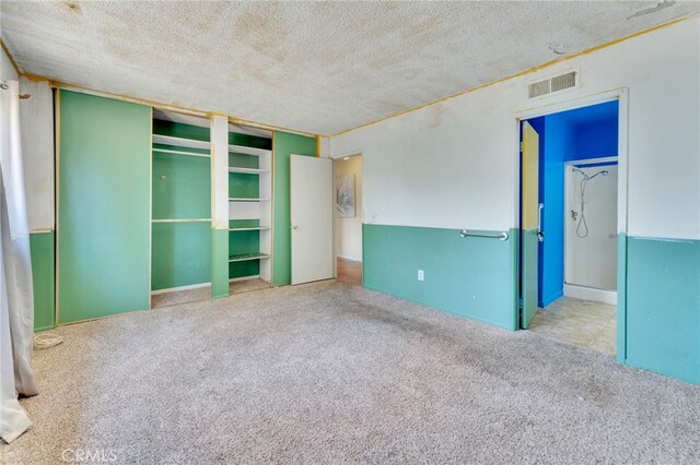 1926 E 7th St, Ontario, CA 91764 - unfurnished bedroom featuring carpet, a textured ceiling, and a closet