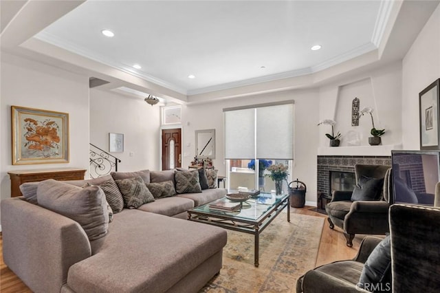 14535 Margate St Unit 13, Sherman Oaks, CA 91411 - living area with a tray ceiling, crown molding, light wood-style flooring, a fireplace with flush hearth, and recessed lighting