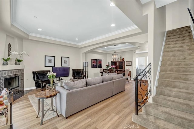14535 Margate St Unit 13, Sherman Oaks, CA 91411 - living area with a raised ceiling, stairway, arched walkways, light wood-type flooring, and recessed lighting
