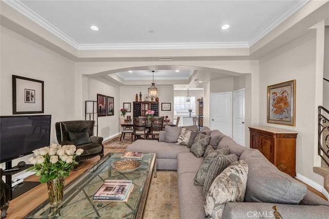 14535 Margate St Unit 13, Sherman Oaks, CA 91411 - living room featuring arched walkways, a tray ceiling, ornamental molding, and recessed lighting