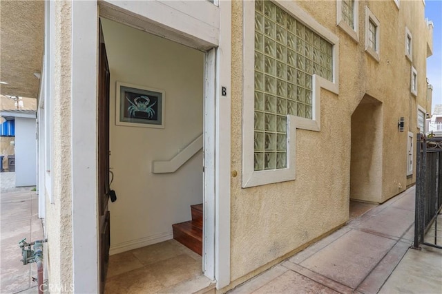 16778 Bayview Dr Unit B, Huntington Beach, CA 92649 - doorway to property featuring stucco siding