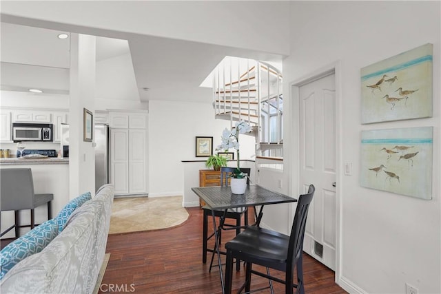 16778 Bayview Dr Unit B, Huntington Beach, CA 92649 - dining room with dark wood finished floors and recessed lighting