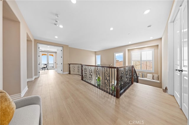 2 Cresta Del Sol, San Clemente, CA 92673 - hallway featuring recessed lighting, light wood-style flooring, french doors, and an upstairs landing