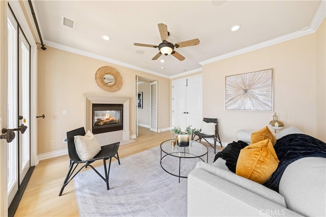 2 Cresta Del Sol, San Clemente, CA 92673 - living room featuring light wood finished floors, a multi sided fireplace, a ceiling fan, ornamental molding, and recessed lighting