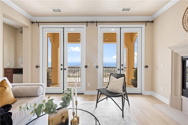 2 Cresta Del Sol, San Clemente, CA 92673 - living area with french doors, light wood-style floors, and ornamental molding