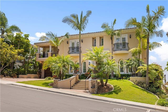 2 Cresta Del Sol, San Clemente, CA 92673 - mediterranean / spanish-style home featuring a balcony, stucco siding, a front yard, and french doors