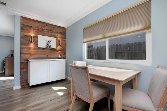 3985 Shenandoah Dr, Oceanside, CA 92056 - dining room featuring light wood-type flooring and wooden walls