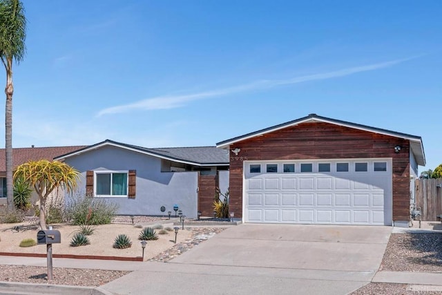 3985 Shenandoah Dr, Oceanside, CA 92056 - ranch-style house featuring concrete driveway, stucco siding, and an attached garage