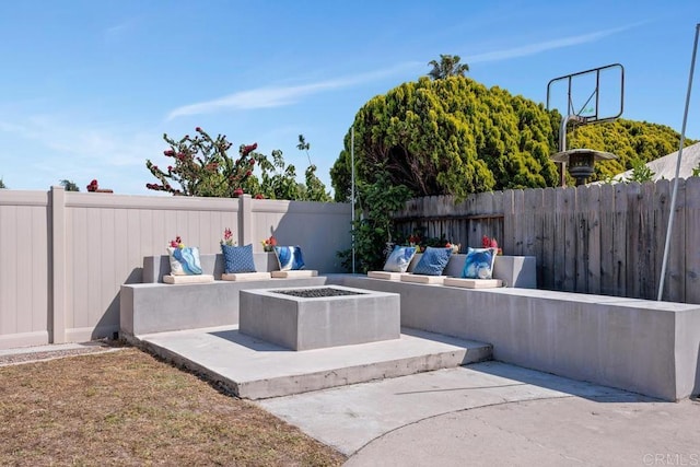 3985 Shenandoah Dr, Oceanside, CA 92056 - fenced backyard featuring a patio and an outdoor living space with a fire pit