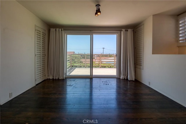 1878 Molino Ave N, Signal Hill, CA 90755 - empty room featuring plenty of natural light and dark wood-type flooring