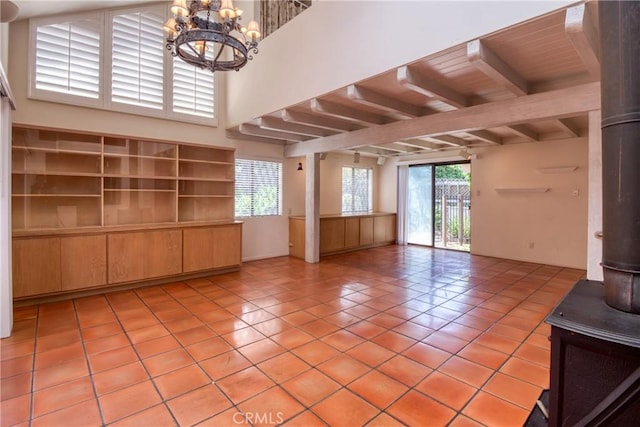 1878 Molino Ave N, Signal Hill, CA 90755 - empty room featuring light tile patterned floors, a chandelier, healthy amount of natural light, and beamed ceiling