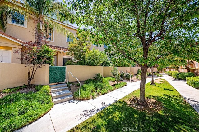 25748 Perlman Pl Unit B, Stevenson Ranch, CA 91381 - view of home's community with a fenced front yard