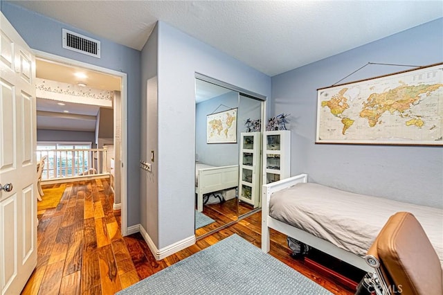 25748 Perlman Pl Unit B, Stevenson Ranch, CA 91381 - bedroom featuring wood finished floors and baseboards