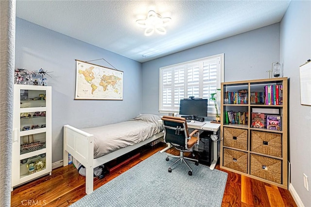 25748 Perlman Pl Unit B, Stevenson Ranch, CA 91381 - bedroom with wood finished floors and a textured ceiling