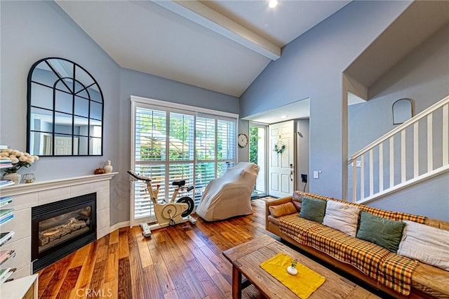 25748 Perlman Pl Unit B, Stevenson Ranch, CA 91381 - living area with wood-type flooring and a tiled fireplace