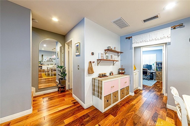 25748 Perlman Pl Unit B, Stevenson Ranch, CA 91381 - hall featuring arched walkways, hardwood / wood-style floors, and recessed lighting
