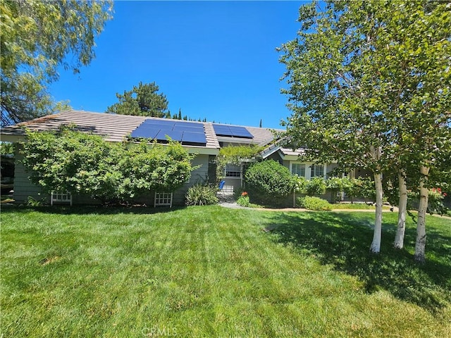 41710 Crispi Ln, Lancaster, CA 93536 - rear view of property featuring a lawn and solar panels