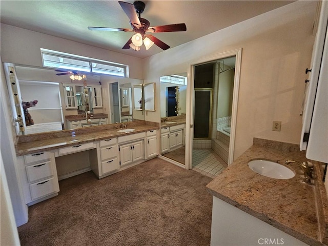 41710 Crispi Ln, Lancaster, CA 93536 - bathroom with a ceiling fan, two vanities, a shower stall, and a tub