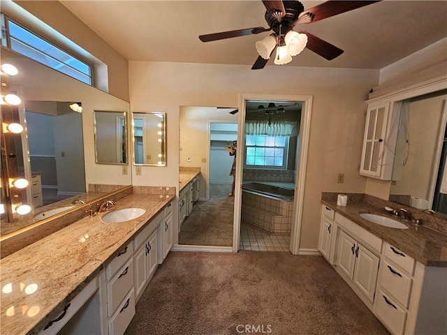 41710 Crispi Ln, Lancaster, CA 93536 - bathroom with two vanities, tiled tub, and a ceiling fan