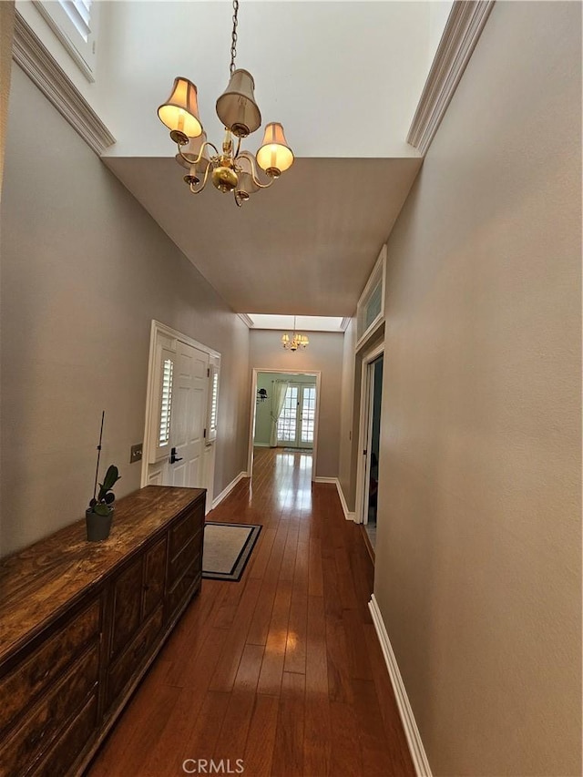 41710 Crispi Ln, Lancaster, CA 93536 - hallway with a chandelier and dark wood-style floors