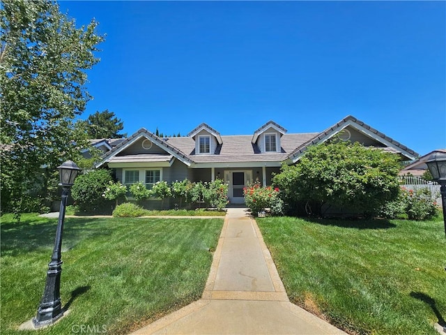 41710 Crispi Ln, Lancaster, CA 93536 - view of front of home with a front lawn and a tile roof