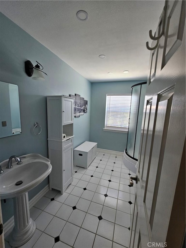 41710 Crispi Ln, Lancaster, CA 93536 - bathroom featuring a stall shower and baseboards