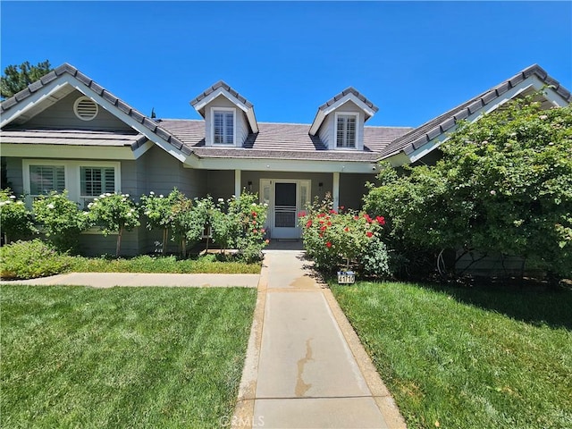 41710 Crispi Ln, Lancaster, CA 93536 - view of front facade featuring a front yard and a tiled roof