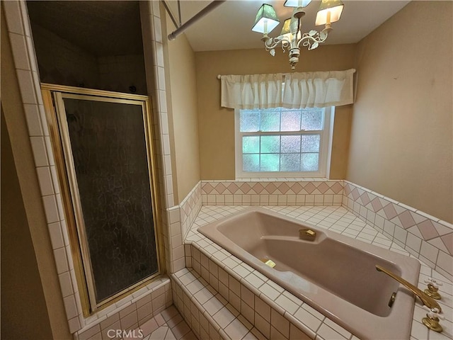 41710 Crispi Ln, Lancaster, CA 93536 - bathroom featuring a bath, a stall shower, a chandelier, and tile patterned floors