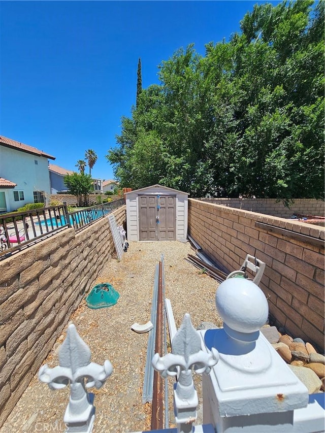 41710 Crispi Ln, Lancaster, CA 93536 - fenced backyard featuring a storage unit