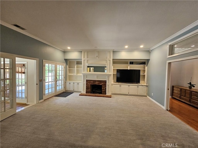41710 Crispi Ln, Lancaster, CA 93536 - unfurnished living room with ornamental molding, carpet, a fireplace, recessed lighting, and french doors