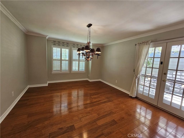 41710 Crispi Ln, Lancaster, CA 93536 - unfurnished dining area with healthy amount of natural light, french doors, a chandelier, dark wood-type flooring, and ornamental molding
