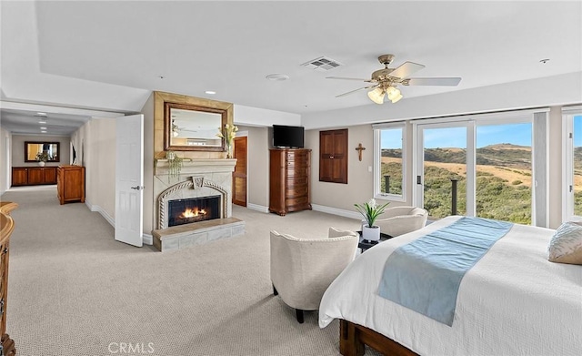 870 Avenida Acapulco, San Clemente, CA 92672 - bedroom featuring light carpet, access to outside, a large fireplace, and a ceiling fan