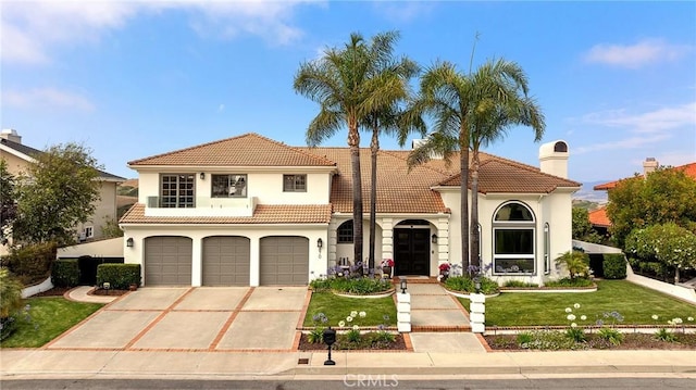 870 Avenida Acapulco, San Clemente, CA 92672 - mediterranean / spanish house featuring a tiled roof, a garage, driveway, a front lawn, and stucco siding