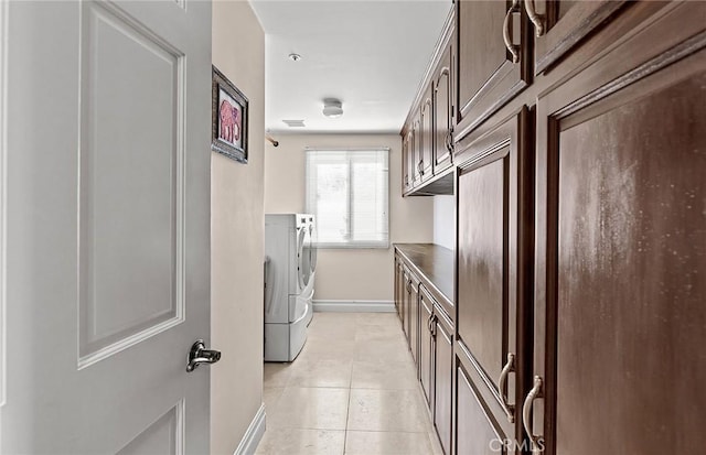 870 Avenida Acapulco, San Clemente, CA 92672 - laundry area featuring washing machine and clothes dryer, light tile patterned flooring, and cabinet space