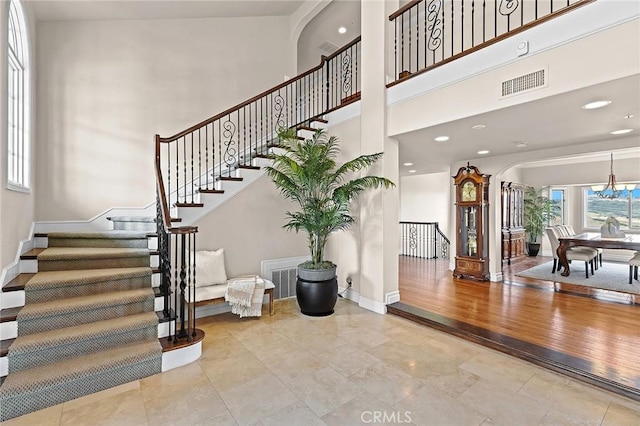 870 Avenida Acapulco, San Clemente, CA 92672 - entrance foyer featuring stairs, arched walkways, a high ceiling, and recessed lighting