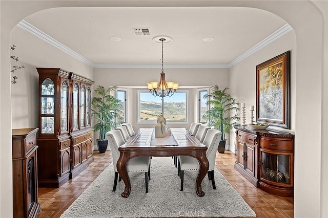 870 Avenida Acapulco, San Clemente, CA 92672 - dining room featuring a chandelier, crown molding, and arched walkways