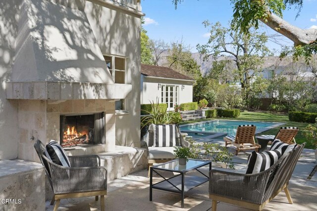 980 El Campo Dr, Pasadena, CA 91107 - view of patio / terrace featuring an outdoor living space with a fireplace and an outdoor pool
