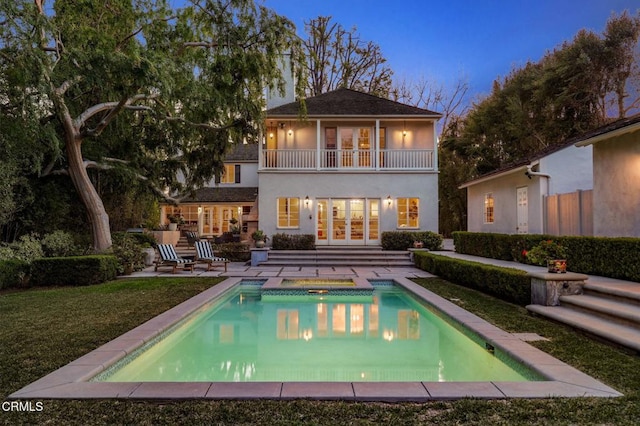 980 El Campo Dr, Pasadena, CA 91107 - rear view of property featuring french doors, a balcony, stucco siding, an outdoor pool, and a hot tub