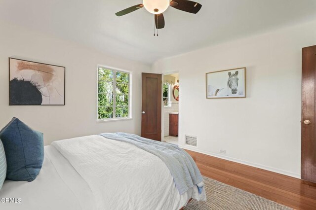 980 El Campo Dr, Pasadena, CA 91107 - bedroom with wood finished floors, a ceiling fan, and connected bathroom