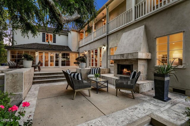 980 El Campo Dr, Pasadena, CA 91107 - view of patio with an outdoor stone fireplace and french doors