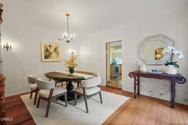 980 El Campo Dr, Pasadena, CA 91107 - dining space featuring beverage cooler, a chandelier, and hardwood / wood-style flooring