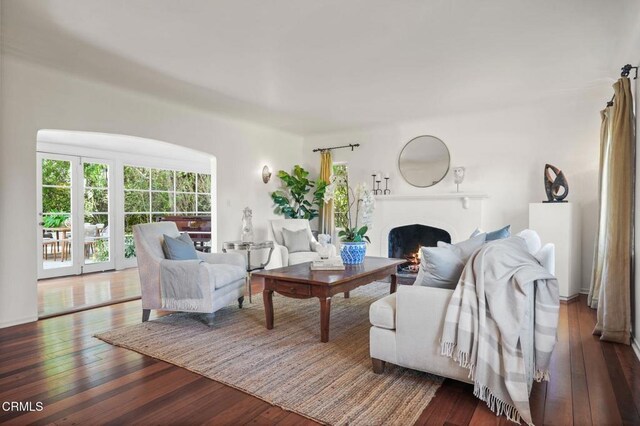 980 El Campo Dr, Pasadena, CA 91107 - living room with dark wood-type flooring and a lit fireplace