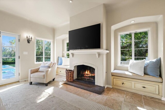 980 El Campo Dr, Pasadena, CA 91107 - living room featuring a warm lit fireplace and plenty of natural light