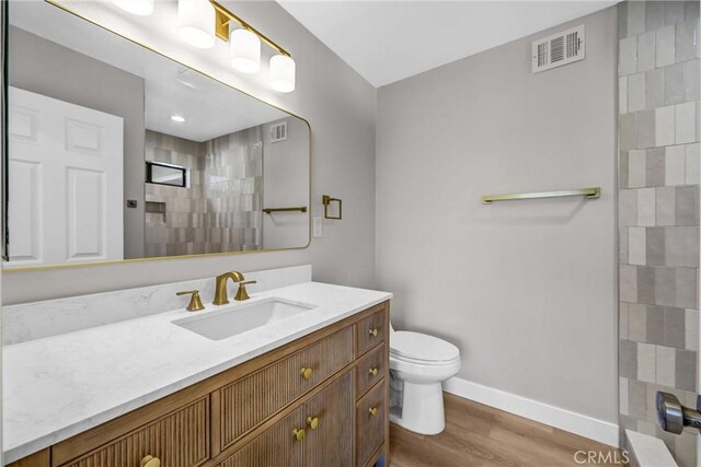 247 El Cielo Ln, Bradbury, CA 91008 - bathroom featuring vanity, wood finished floors, and a shower