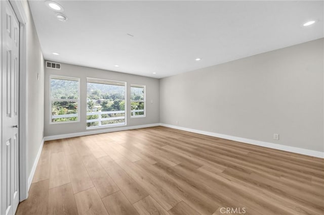 247 El Cielo Ln, Bradbury, CA 91008 - unfurnished room featuring light wood-type flooring, recessed lighting, and a smoke detector